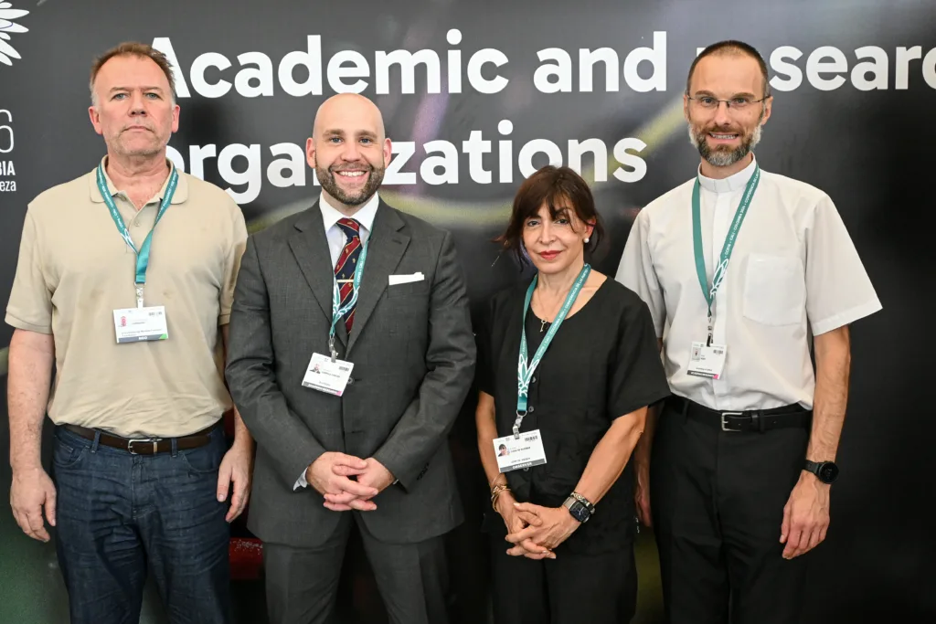 Patricio Lombardi, Salvatore Coppola-Finegan, Emilce Cuda and Fr. Peter Rožič SJ at the Academic and Research Organizations room, COP16.